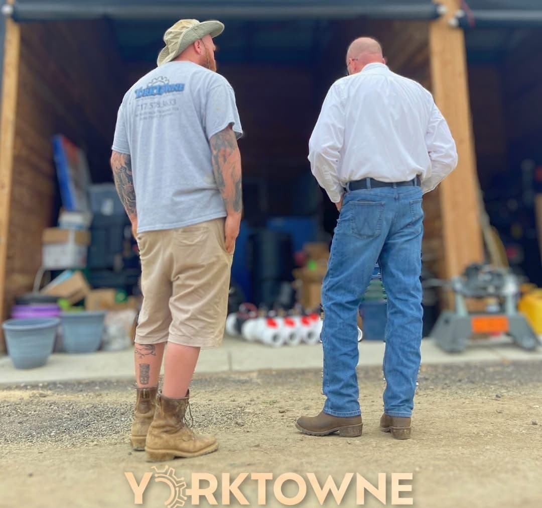 Yorktowne technician walking a homeowner through their property