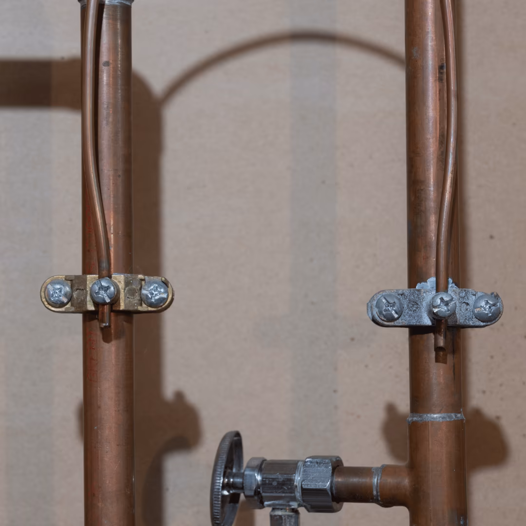 Copper supply lines with clamps and a shutoff valve