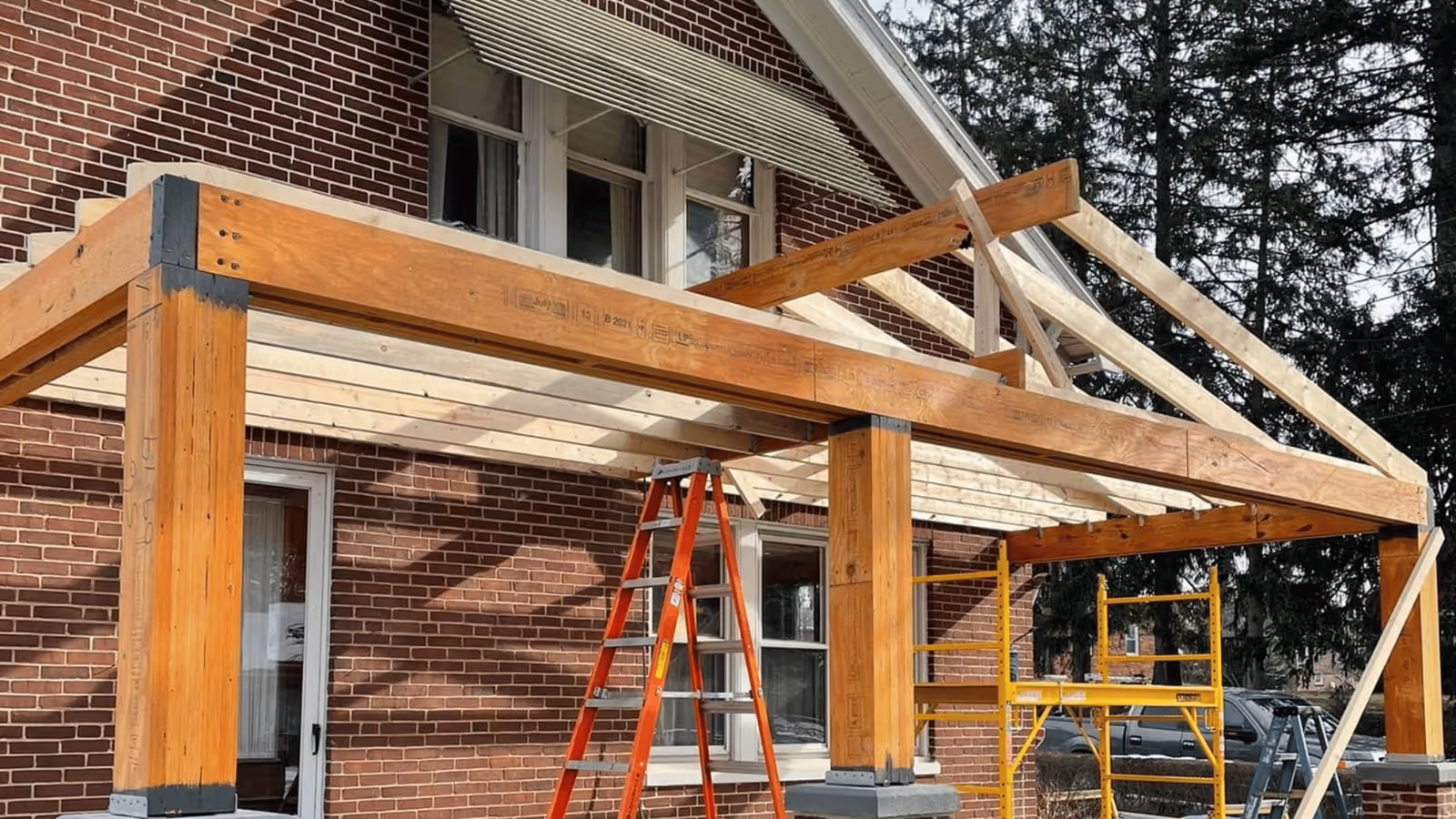 New timber porch framing on a brick home
